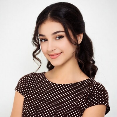 Smiling young woman in polka dot dress