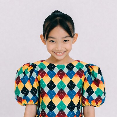 Asian girl smiling in colorful dress