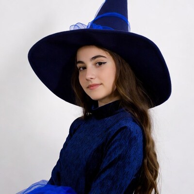 Girl in blue witch hat costume