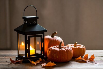 Black Lantern with Pumpkins and Autumn Leaves