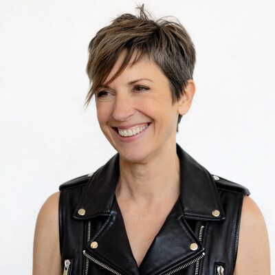 Smiling woman in black leather vest