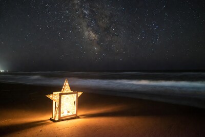 Lit Star Lantern on Beach with Milky Way
