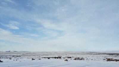 Snowy Plains Under Blue Sky