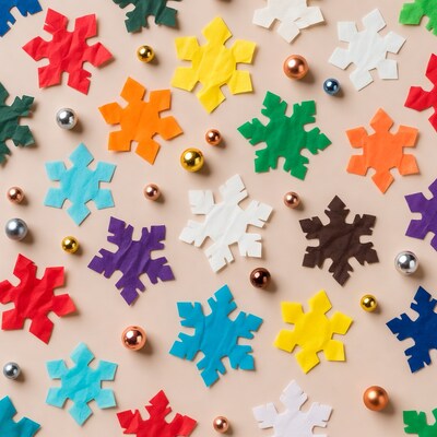 Colorful paper snowflakes and beads