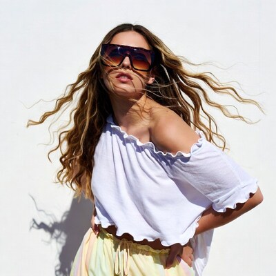 Woman in sunglasses with wavy hair