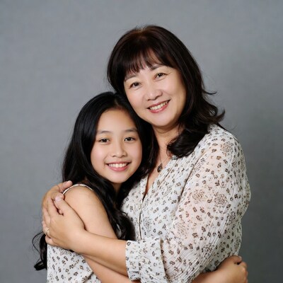 Asian mother hugging daughter