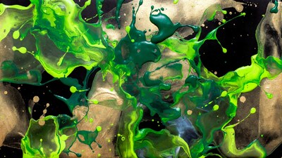 Green paint splatters on black gold background