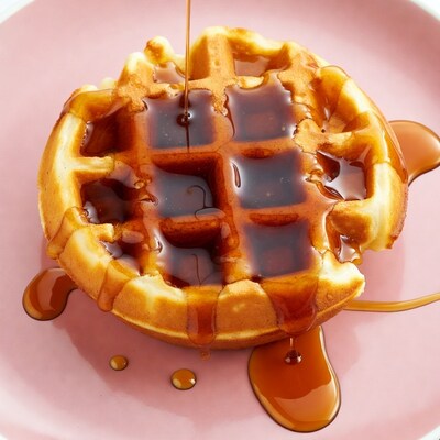 Waffle with pouring maple syrup