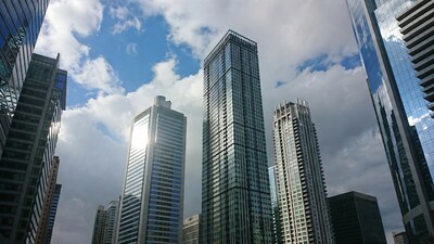 Skyscrapers under cloudy sky