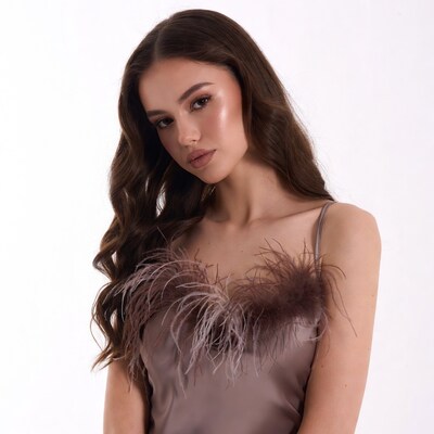 Woman in gray feather-trimmed slip dress
