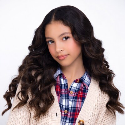 Girl with curly hair in plaid shirt