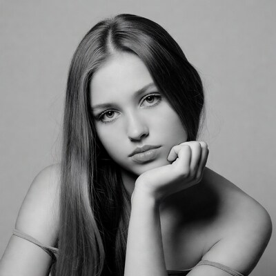 Woman resting chin on hand