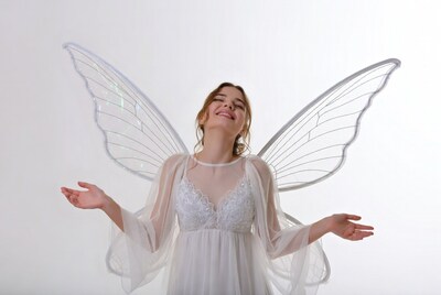 Woman with fairy wings smiling