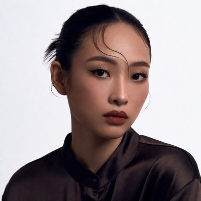 Asian woman in brown silk shirt
