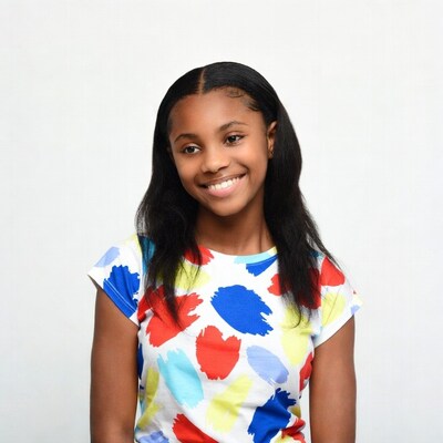 Smiling African-American girl in colorful shirt