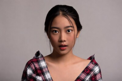 Asian woman in plaid shirt closeup