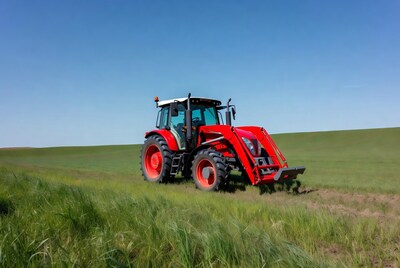 Red tractor in green field
