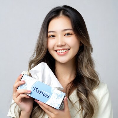 Asian woman holding tissues box