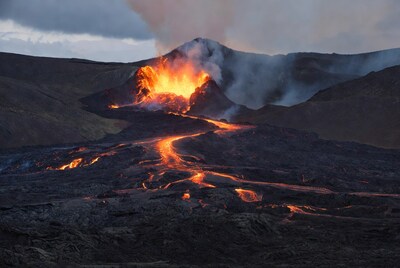 Active volcano erupting lava flows