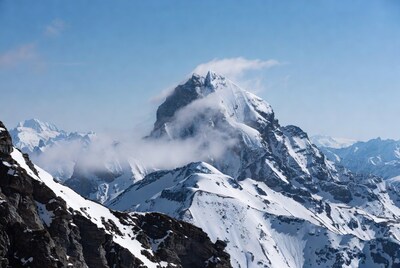 Snowy Mountain Peak with Clouds