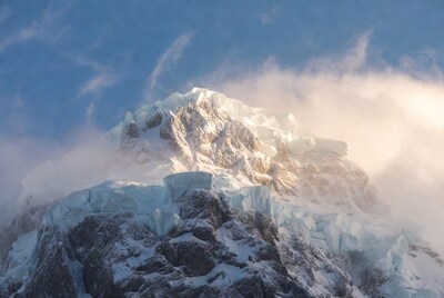 Snowy Mountain Peak in Clouds