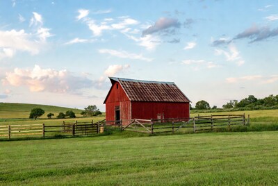 Red barn in green field