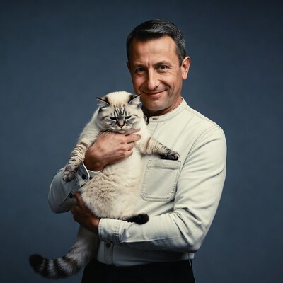 Man holding fluffy British Shorthair cat