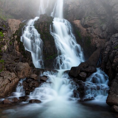 Majestic Waterfall Cascading Over Rocks