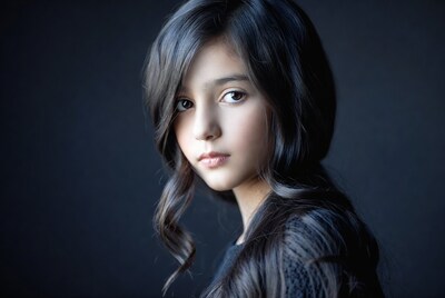 Young girl with dark wavy hair
