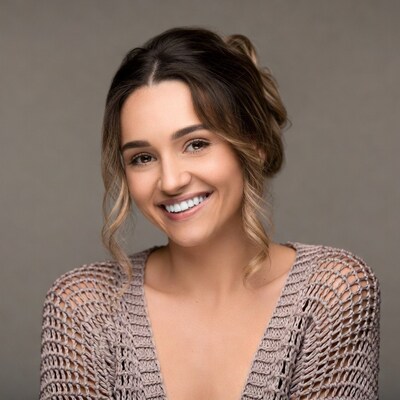 Smiling woman in crochet top