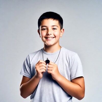 Boy holding whistle necklace
