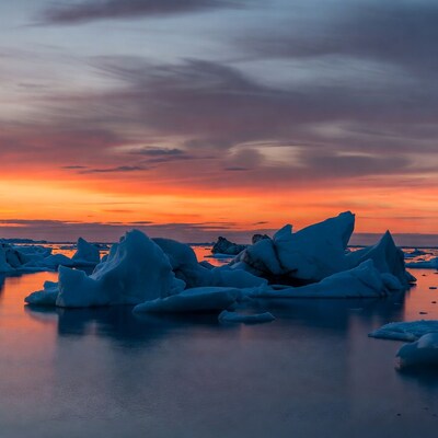 Icebergs in sunset Arctic waters