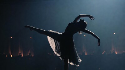 Ballerina in silhouette performing arabesque