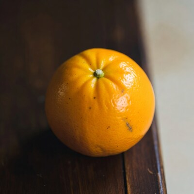 Fresh orange on wooden table