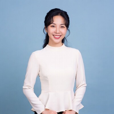 Asian woman smiling in white peplum top