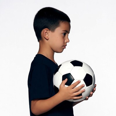 Boy holding soccer ball