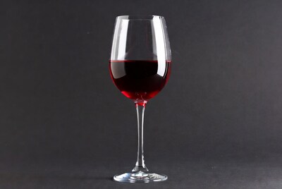 Red Wine Glass on Black Background