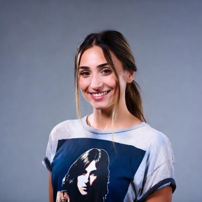 Smiling woman in Jim Morrison t-shirt