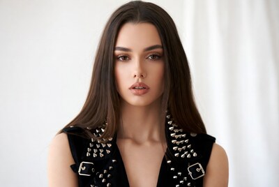 Woman in studded black vest