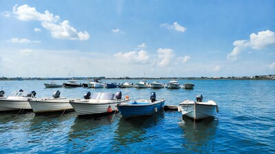 Row of boats docked on lake