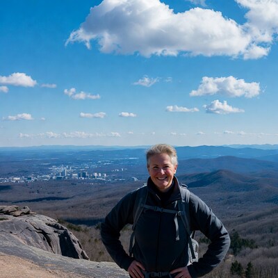 Smiling woman on mountain overlook