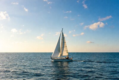 White sailboat sailing on ocean