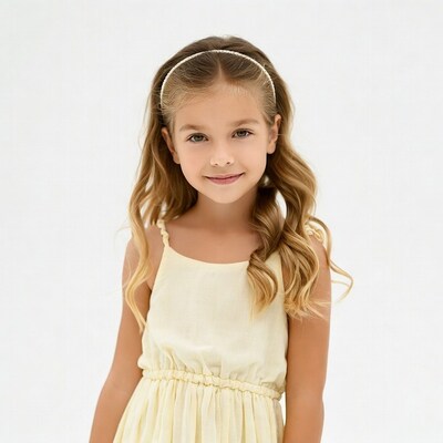 Girl in yellow dress smiling