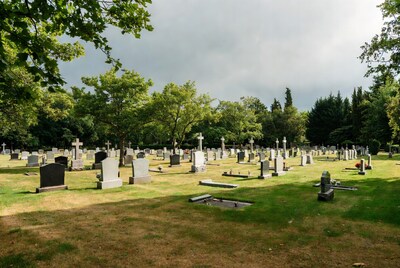 Cemetery with gravestones and trees