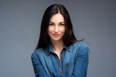 Woman smiling in denim shirt