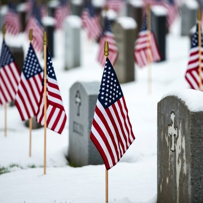 American flags on snowy gravestones