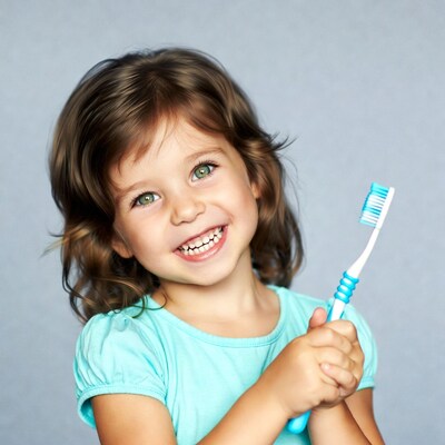 Girl smiling with blue toothbrush