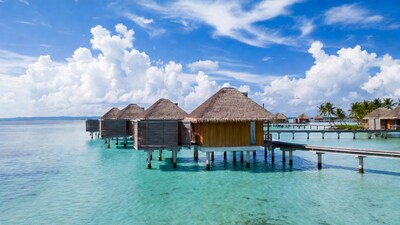 Overwater bungalows in turquoise lagoon