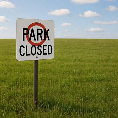 Park Closed sign in green field