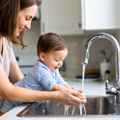 Mother and baby washing hands